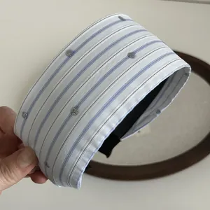 Detail of blue striped wide headband with silver glitter dots and non-slip inner lining