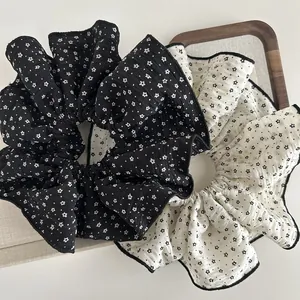 Floral print oversized scrunchies set in black and white fabric with contrast edging