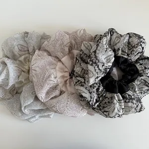 Three-piece large paisley floral satin scrunchie set in grey, pink, and black colors