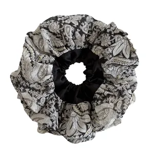 Oversized paisley floral scrunchie in black and white satin with ruffles