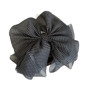 Elegant black and white polka dot mesh bow hair claw clip for a vintage feminine style