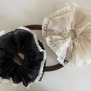 Elegant oversized pleated chiffon scrunchies with white lace edges in black and cream beige