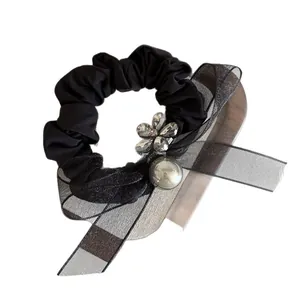 Elegant black scrunchie with sparkling rhinestone flower and grey faux pearl bow