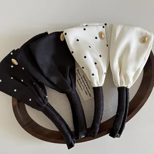 Elegante Satin-Bananenspangen mit Schleife, schwarz-weiß gepunktet, mit Goldverzierung