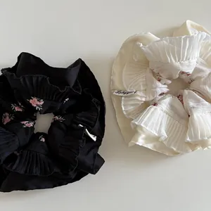 Floral pleated scrunchie set in black and cream chiffon with ruffled edge design