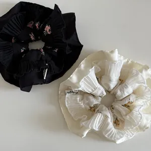 Floral pleated hair scrunchies in black and beige satin fabric for women accessories