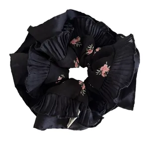 Pleated black floral scrunchie with pink flowers and premium chiffon texture