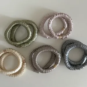 Set of 10 satin hair scrunchies in Morandi colors with pleated texture and round buckles