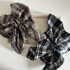 Vintage plaid scrunchies set in brown and black checkered woven fabric for ponytails
