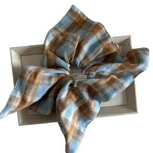 Chic blue and brown plaid oversize scrunchie in soft cotton fabric for elegant ponytails