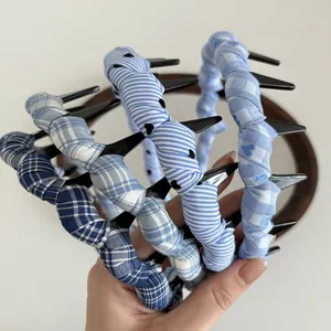 Three-piece set of blue plaid and striped wavy headbands with inner plastic teeth