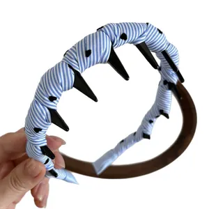 Minimalist blue striped fabric headband with internal teeth for secure hair styling