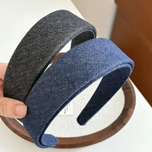 Detailed texture of thick denim fabric padded headbands in dark grey and blue colors