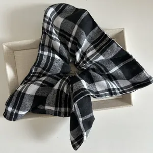 Classic black and white checkered scrunchie with cute bunny ears for ponytails