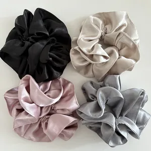 Set of four premium pearl satin scrunchies in black, champagne, pink and silver grey