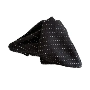 French style black and white polka dot hair claw clip with elegant fabric texture