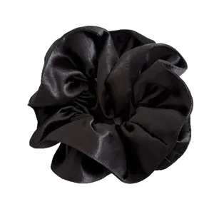 Elegant heavy satin oversized black scrunchie with a silky pearl finish and pleats