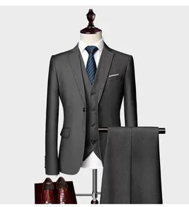 Slim fit three-piece charcoal grey suit for men featuring a blazer, vest and flat front trousers