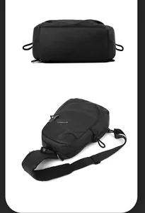 Detail of waterproof black crossbody bag showing wide mesh strap and sturdy buckle