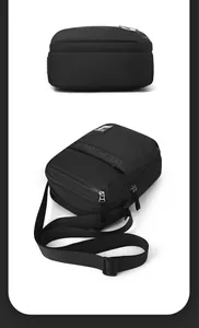 Close-up of black nylon shoulder bag showing woven texture and adjustable strap details