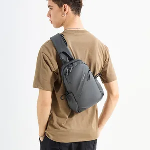 Water-resistant dark grey crossbody sling bag for men with adjustable shoulder strap