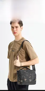 Detail of grey camo crossbody bag with multi-pocket zippers and top handle for men