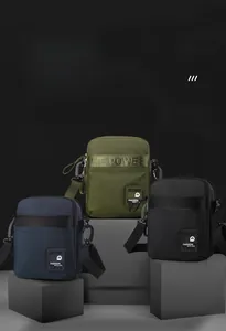 Detailed view of casual men's small crossbody bags in navy, army green, and black fabric