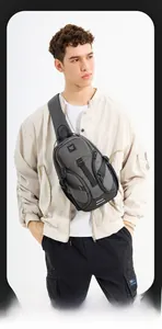 Close-up of lightweight grey business chest bag featuring durable zippers and buckle straps