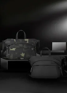 Close-up of waterproof nylon crossbody bags in black and camo with 3D logo detail