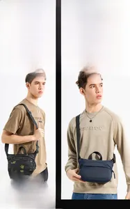 Detail showing men's camo crossbody bag in black and navy with adjustable straps