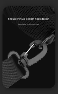 Detail of the detachable plastic hook and metal clip on a breathable mesh backpack strap