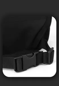 Close-up of a durable black plastic side release buckle and high-density nylon webbing