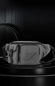 Close-up of gray waterproof nylon travel fanny pack with tactical pocket and orange strap