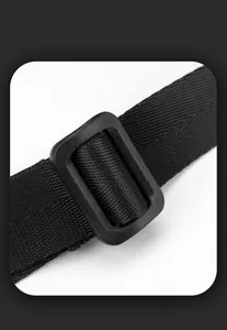 Detail of black nylon strap with durable plastic slider buckle for shoulder bag