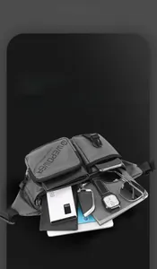 Detail of multi-layer interior storage for gray crossbody bag with gadgets and keys