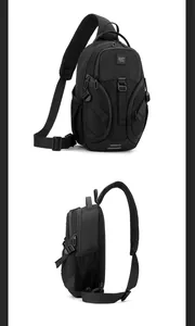 Detail view of black tactical sling bag with multi-zipper pockets and breathable mesh back