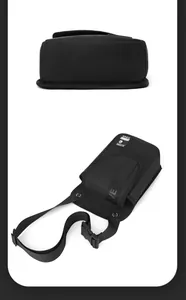 Detailed bottom width and top view of a black nylon tactical shoulder bag for men