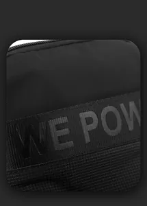 Close-up of black nylon shoulder bag featuring decorative grey WE POW logo webbing