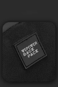 Detail shot of the black nylon fabric and the embossed square logo on the shoulder bag