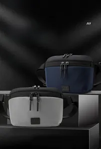 Detail of navy blue and grey tactical chest bags with durable ripstop fabric texture