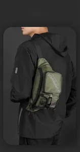 Detail of army green tactical chest bag with water-resistant fabric and quick-release buckle