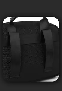 Detail view of the durable nylon fabric and MOLLE webbing system on the back of the bag