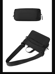Minimalist black crossbody bag featuring durable nylon fabric and adjustable strap buckles