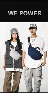 Urban techwear nylon crossbody bags in cream and navy blue worn by stylish models