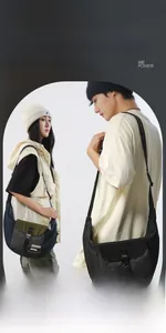 Detailed view of cargo-style crossbody bag showing buckle closure and mesh texture