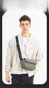Detail of army green messenger bag featuring adjustable strap and branded flip cover