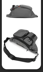 Detail of dark grey water-resistant nylon waist bag featuring multiple zipper compartments
