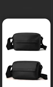 Detailed close-up of a black crossbody bag showing durable tech fabric and adjustable strap