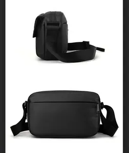 Detailed view of black crossbody bag featuring adjustable strap and waterproof nylon texture
