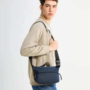 Minimalist navy blue crossbody chest bag for men with adjustable strap and dual zippers